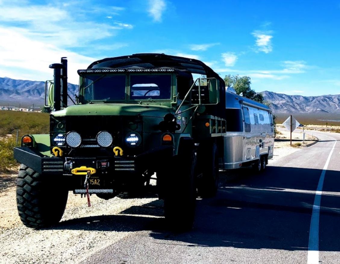 airstream with military truck