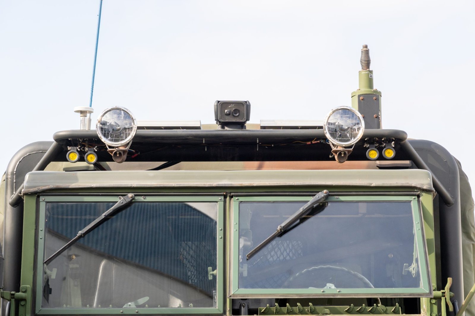 Custom DOM steel roof rack with LED off-road lights on M35A3 cab